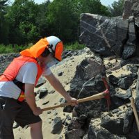 Miner or construction worker with neck shade and visor sealer