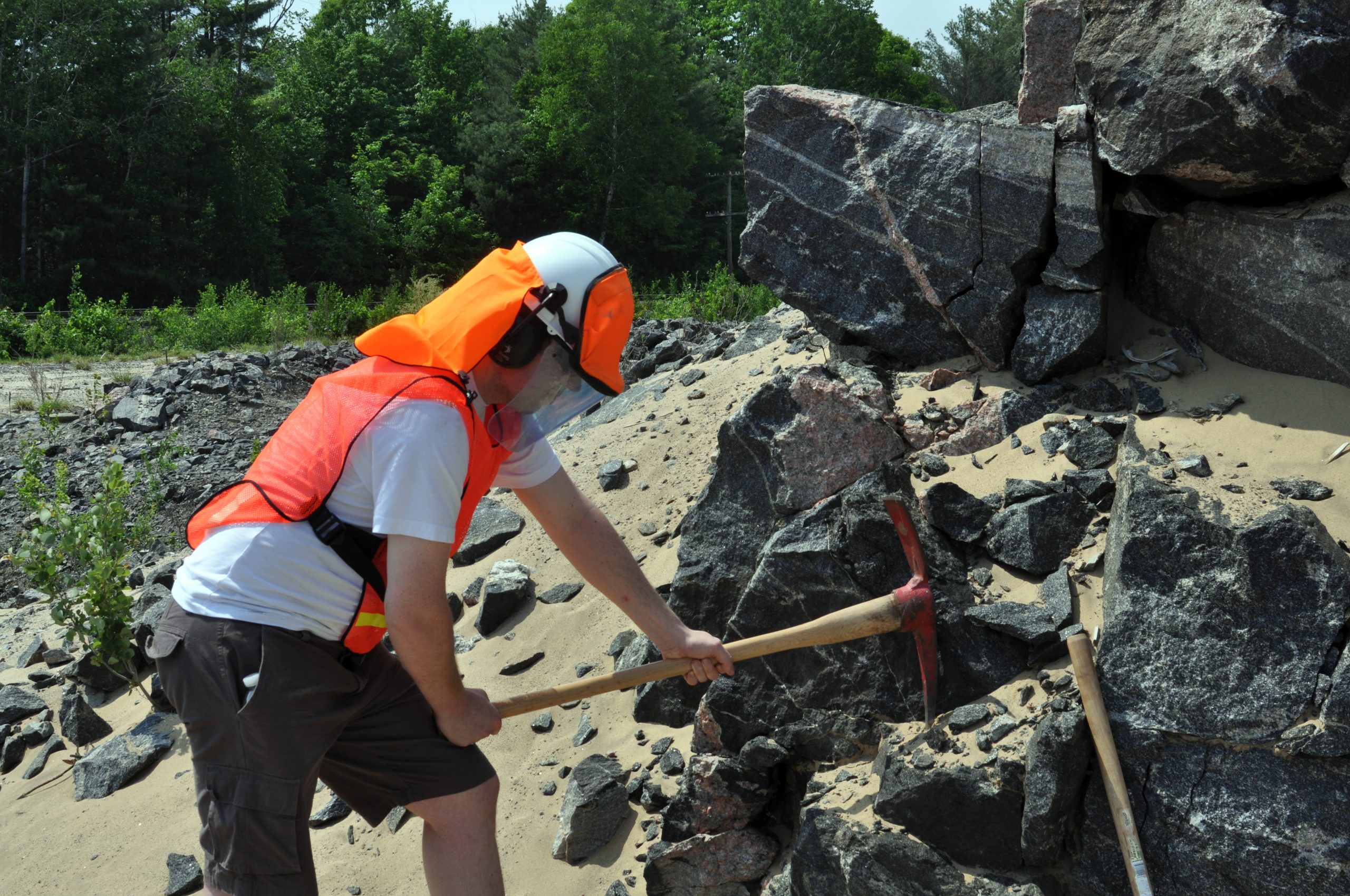 Miner or construction worker with neck shade and visor sealer